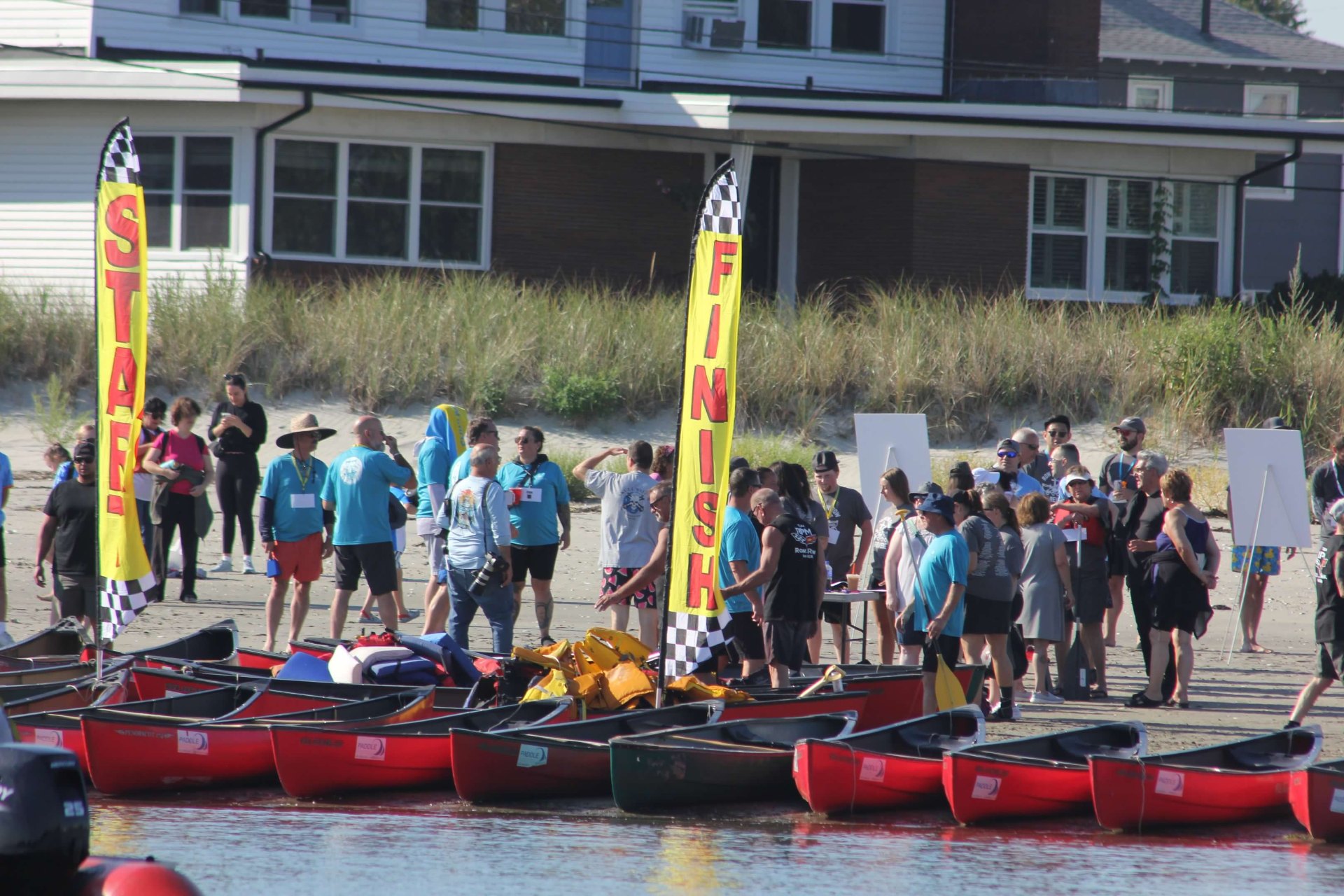 Paddlers gathering at the Row Row Row In Revere start line